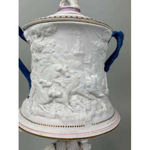 616 - A STAFFORDSHIRE PARIAN WARE TWIN HANDLE URN AND COVER ATTRIBUTED TO GEORGE JONES 38cm x 22cm The urn... 