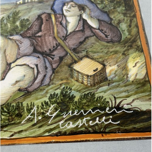 619 - A MAJOLICA CASTELLI TILE DEPICTING A SLEEPING YOUTH, SIGNED A. GUERNIERI 40cm x 30cm Two repairs. Fr... 