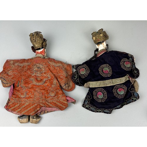 621 - A PAIR OF EARLY 20TH CENTURY CHINESE BISQUE PUPPETS WITH SILK COSTUMES (2) 34cm x 25cm