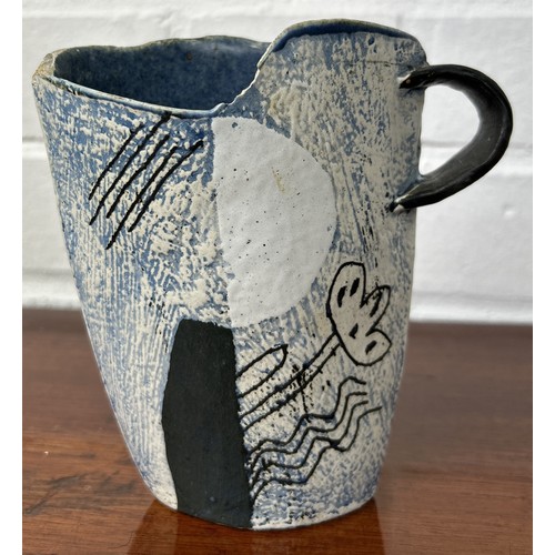 644 - JOHN MALTBY: A STUDIO POTTERY JUG 14cm x 13cm Some chips