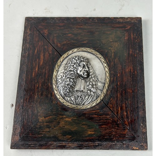 641 - A SILVER PORTRAIT BAS RELIEF ROUNDEL OF CHARLES II 9cm x 7cm In wooden frame 20cm x 19cm