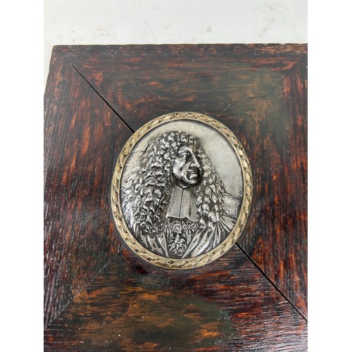 641 - A SILVER PORTRAIT BAS RELIEF ROUNDEL OF CHARLES II 9cm x 7cm In wooden frame 20cm x 19cm