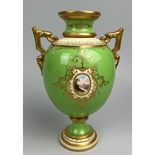 654 - A COALPORT PORCELAIN URN WITH CENTRAL PAINTED LANDSCAPE PANEL, GILT DETAIL ON PALE GREEN GROUND 21cm... 