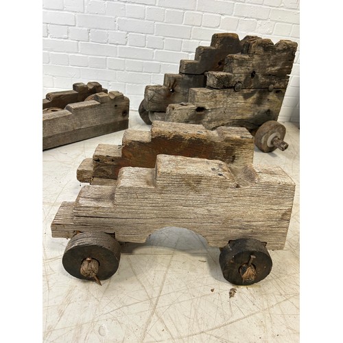 673A - A GROUP OF THREE ANTIQUE CANNON CARRIAGES Largest 74cm x 54cm x 35cm