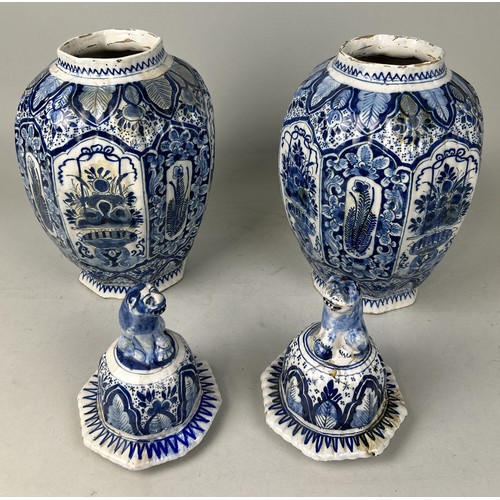 668 - A PAIR OF DUTCH 18TH CENTURY DELFT VASES AND COVERS Some restorations. 42cm H