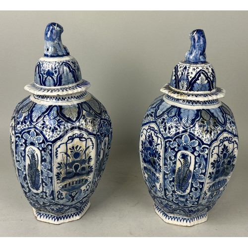 668 - A PAIR OF DUTCH 18TH CENTURY DELFT VASES AND COVERS Some restorations. 42cm H