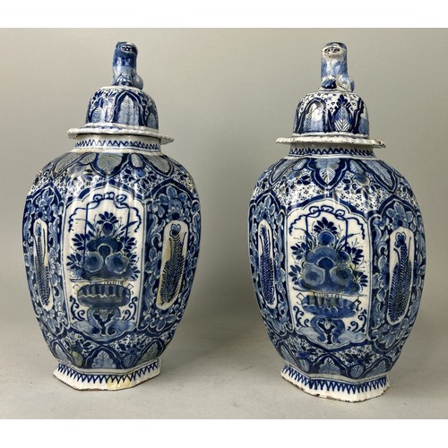 668 - A PAIR OF DUTCH 18TH CENTURY DELFT VASES AND COVERS Some restorations. 42cm H