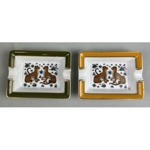 689A - A PAIR OF HERMES LIMOGES PORCELAIN TRINKET DISHES DECORATED WITH LEOPARDS 8cm x 6cm each.