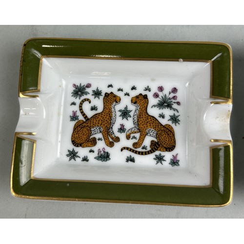 689A - A PAIR OF HERMES LIMOGES PORCELAIN TRINKET DISHES DECORATED WITH LEOPARDS 8cm x 6cm each.