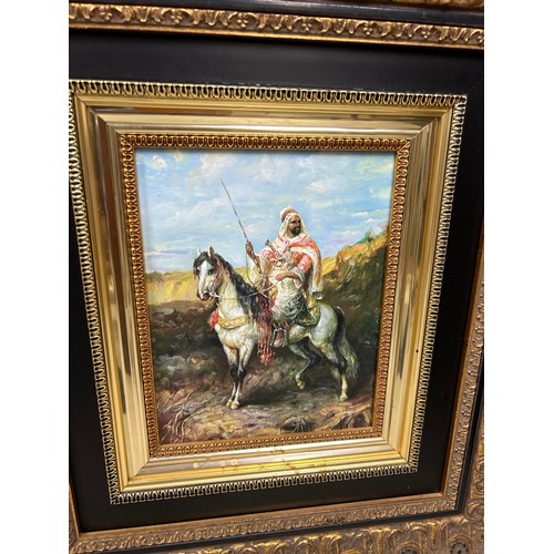 857 - PERSIAN SCHOOL: A PAIR OF OIL PAINTINGS ON BOARD DEPICTING HORSES AND RIDERS 24cm x 19cm each. Frame... 