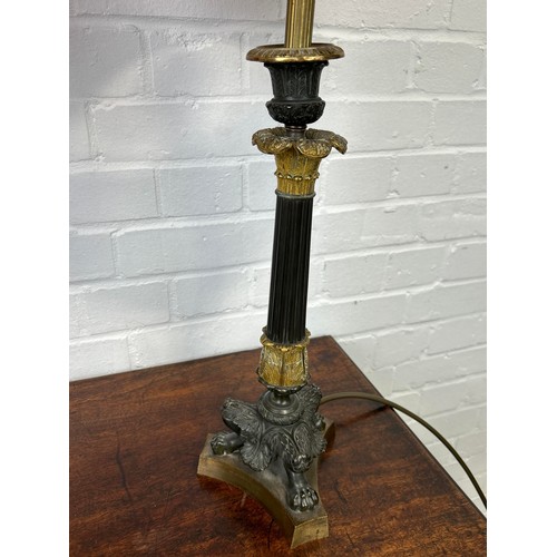 985 - A PAIR OF EMPIRE BRONZE CANDLESTICKS 52cm each. With red shades, need reattaching to lamp. Purchased... 