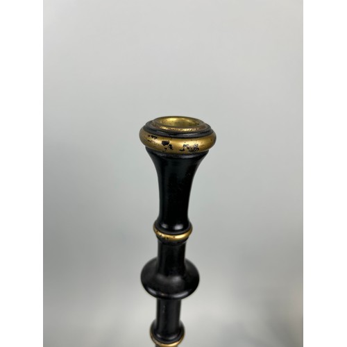 988 - A PAIR OF 'WOOLPIT INTERIORS' EBONISED AND GILT CANDLESTICKS ALONG WITH TWO PAINTED TABLE LAMPS (4) ... 