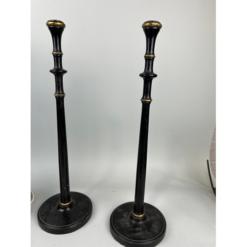 988 - A PAIR OF 'WOOLPIT INTERIORS' EBONISED AND GILT CANDLESTICKS ALONG WITH TWO PAINTED TABLE LAMPS (4) ... 