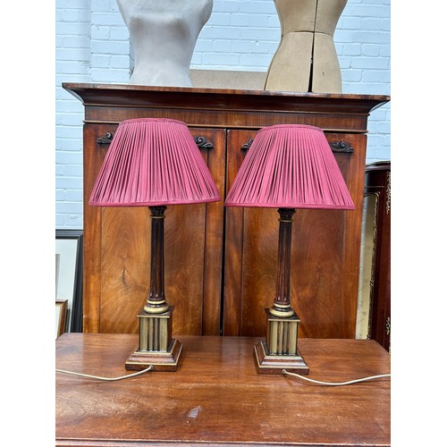 995A - ATTRIBUTED TO MAITLAND SMITH: A PAIR OF FAUX BOOK DESIGN TABLE LAMPS WITH PLEATED SHADES 67cm H incl... 