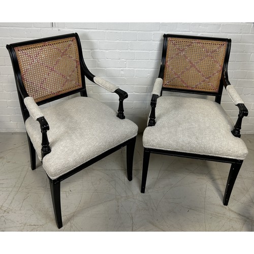 1044 - A PAIR OF EBONISED BLACK ARMCHAIRS WITH CANED BACKS 93cm x 53cm x 53cm