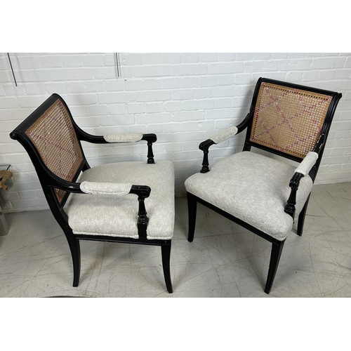 1044 - A PAIR OF EBONISED BLACK ARMCHAIRS WITH CANED BACKS 93cm x 53cm x 53cm