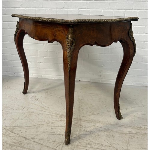 1052A - A LATE 19TH CENTURY FRENCH BURR WALNUT TABLE WITH SHAPED TOP Gilt metal mounts, one fitted drawer. 9... 