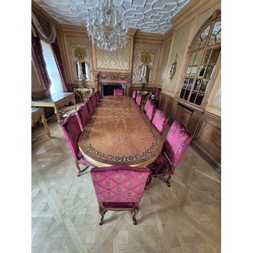 1055D - PROPERTY FROM THE QATAR EMBASSY: A LARGE DINING TABLE WITH MARQUETRY INLAY ALONG WITH FIFTEEN CHAIRS... 