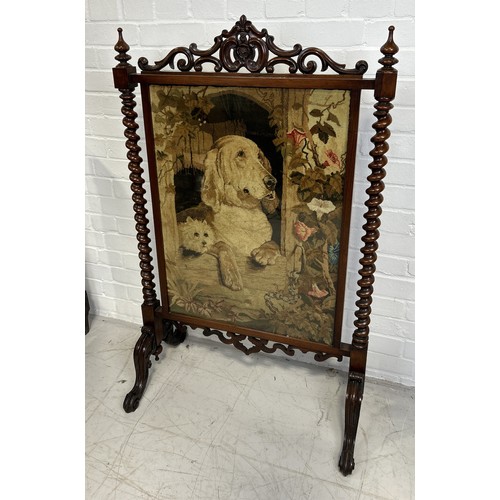 1074 - A VICTORIAN MAHOGANY FIRE SCREEN WITH EMBROIDERED PANEL DEPICTING A DOG 115cm x 71cm