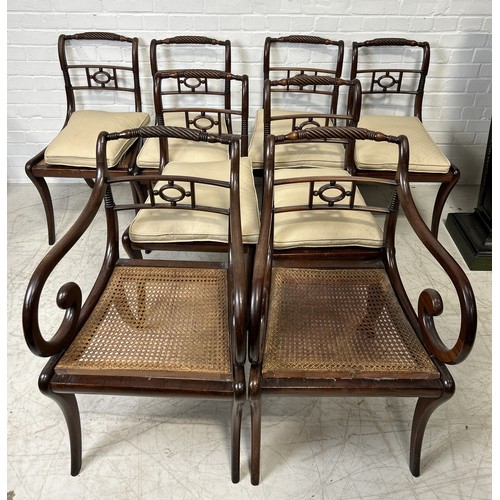 1079 - A SET OF EIGHT REGENCY MAHOGANY DINING CHAIRS WITH CANE SEATS TO INCLUDE TWO CARVERS (8) The side ch... 