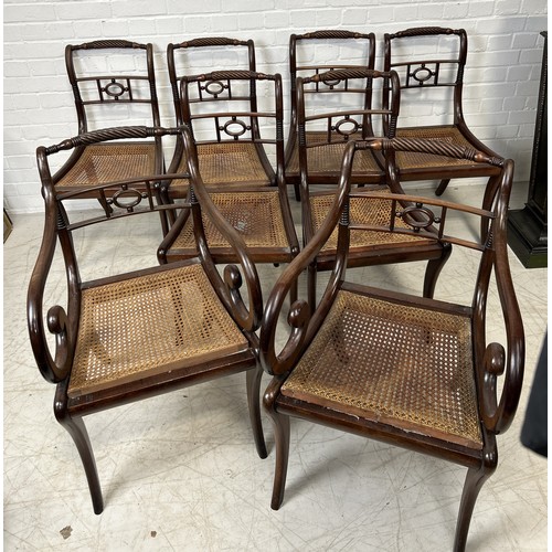 1079 - A SET OF EIGHT REGENCY MAHOGANY DINING CHAIRS WITH CANE SEATS TO INCLUDE TWO CARVERS (8) The side ch... 