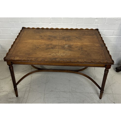 1099 - A WOODEN COFFEE TABLE WITH WAVE CUT EDGES