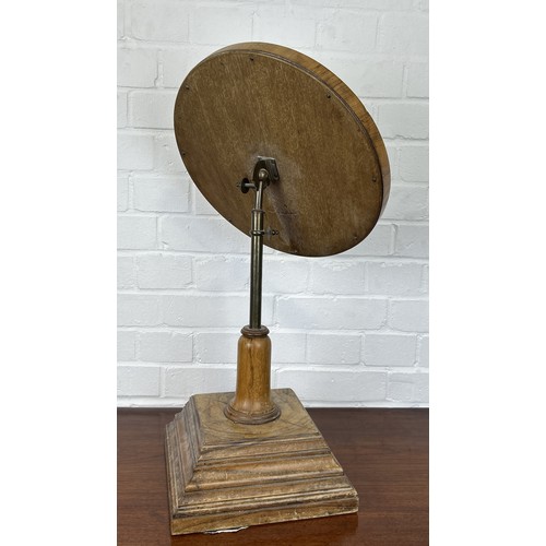 1107 - AN EARLY 20TH CENTURY WALNUT VENEER REVOLVING DRESSING MIRROR ON STAND 65cm x 35cm