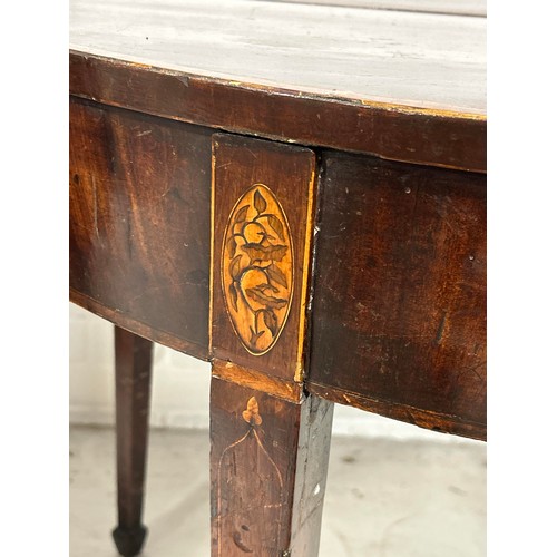 1122 - AN ANTIQUE DEMI LUNE MARQUETRY INLAID CARD TABLE 89cm x 71cm x 44cm when closed.