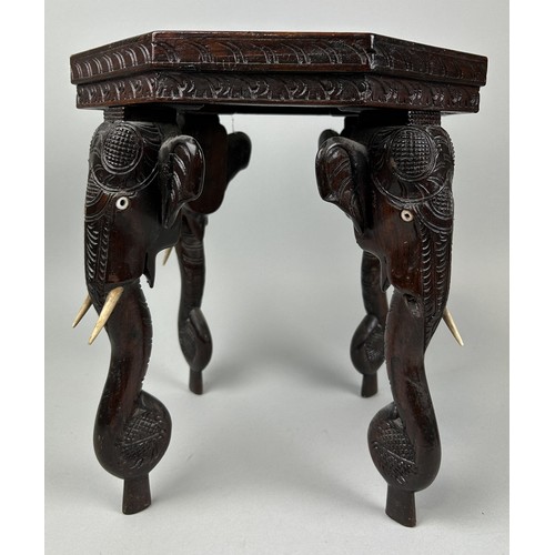 1126 - AN INDIAN OCCASIONAL TABLE WITH ELEPHANT HEAD SUPPORTS 34cm x 30cm