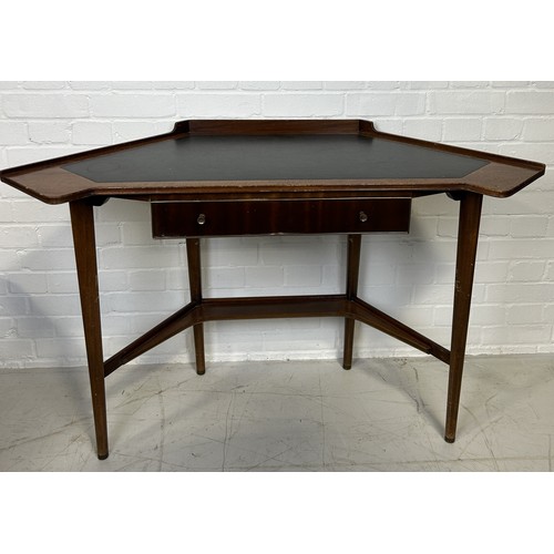 1145 - A MID-CENTURY WRITING DESK, IN THE STYLE OF GORDON RUSSELL (1892-1980) Teak, brass and black leather... 