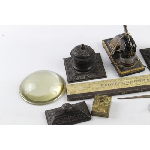 1197 - ANTIQUE DESKTOP ITEMS INCLUDING INKWELLS , EMBOSSER, PAPERWEIGHT, SHARPENER