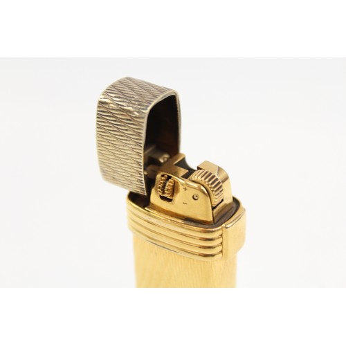 1207 - A CHRISTIAN DIOR PARIS GOLD PLATED POCKET LIGHTER SWISS MADE GUILLOCHE DESIGN