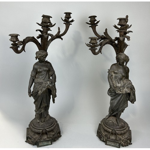 1215 - A PAIR OF FRENCH HEAVY CAST METAL FIGURAL CANDElABRA (2) Both damaged, but with various missing piec... 