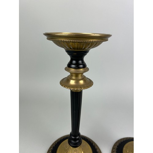 1075D - A PAIR OF GILT CANDLESTICKS