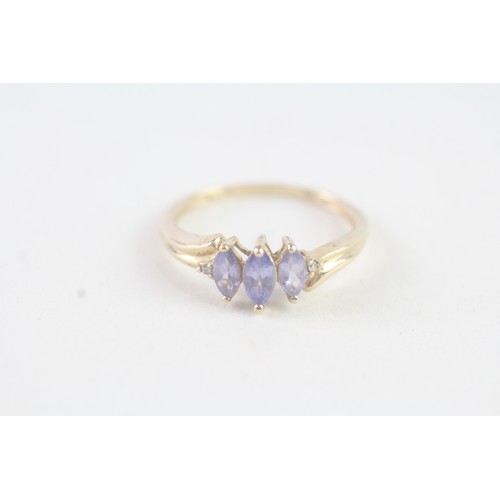 177 - A 9CT GOLD MARQUISE CUT TANZANITE AND DIAMOND DRESS RING Weight: 1.5 gms