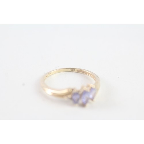 177 - A 9CT GOLD MARQUISE CUT TANZANITE AND DIAMOND DRESS RING Weight: 1.5 gms