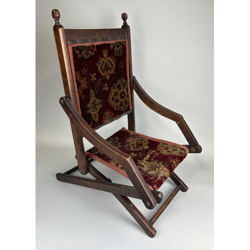 1007 - AN ANTIQUE FOLDING CHILD'S CHAIR
 
63 x 47 x 31 cm