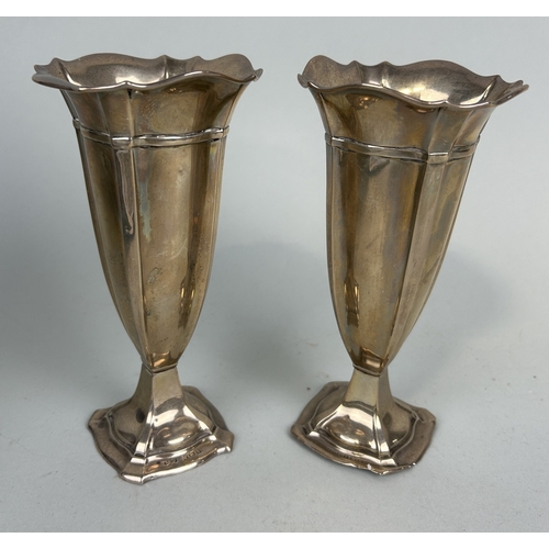 115 - A PAIR OF SILVER POSY VASES
17cm H