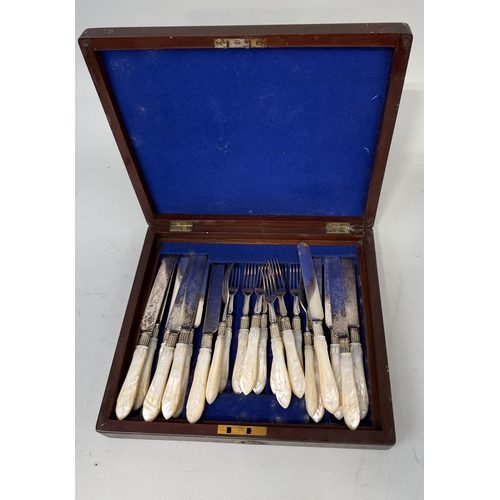 117 - A MOTHER OF PEARL HANDLE CUTLERY SET
Comprising knives and forks.
In mahogany case.... 