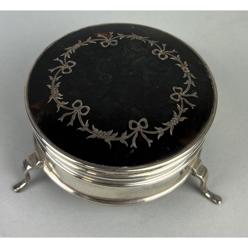 121 - AN ANTIQUE SILVER TORTOISESHELL BOX
The larger box on three legs, 9cm x 5cm