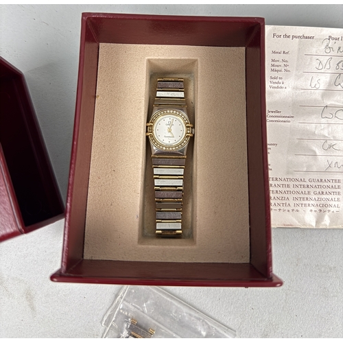 144 - AN OMEGA CONSTELLATION WATCH WITH DIAMOND BEZEL AND 18CT GOLD AND 925 SILVER BRACELET