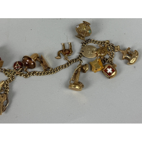 150 - AN 18CT GOLD CHARM BRACELET
The charms ranging from 9ct to 18ct and possibly foreign gold or yellow ... 