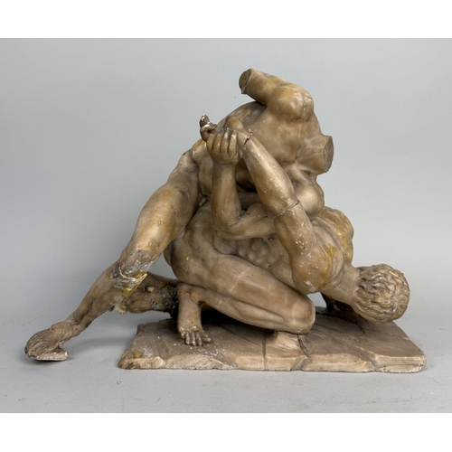 17 - A MARBLE OR ALABASTER SCULPTURE DEPICTING TWO WRESTLERSVarious losses, one leg detached but present.... 