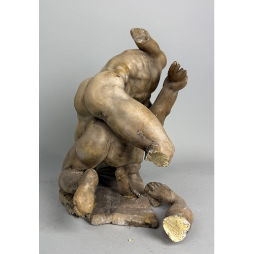 17 - A MARBLE OR ALABASTER SCULPTURE DEPICTING TWO WRESTLERSVarious losses, one leg detached but present.... 