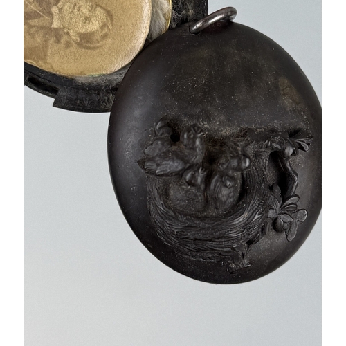 191 - A CARVED MOURNING LOCKET WITH BIRDS AND NEST, WITH LADIES PHOTOGRAPH WITHIN