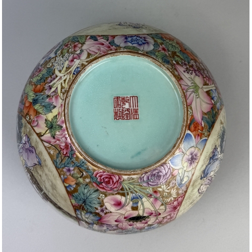 196 - A CHINESE REPUBLIC PERIOD MILLEFLEUR ENAMELLED BOWL
With three oval panels painted with three figure... 