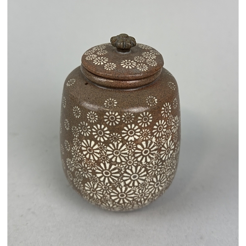 204 - SHIN SANG-HO (KOREAN B.1947): A GLAZED CERAMIC POT AND COVER
With floral design.... 