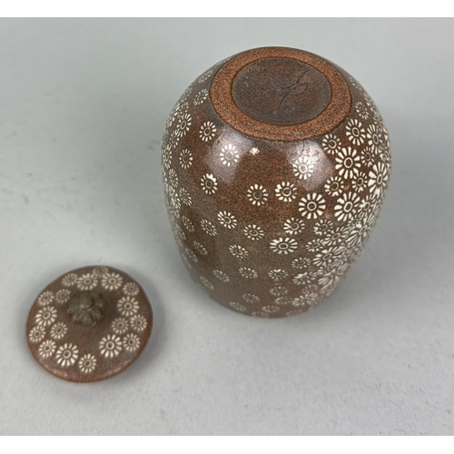 204 - SHIN SANG-HO (KOREAN B.1947): A GLAZED CERAMIC POT AND COVER
With floral design.... 