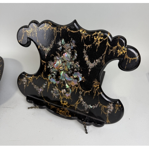 225 - A BLACK LACQUERED AND GILT DISH ALONG WITH A MOTHER OF PEARL INLAID STAND
Dish 37cm x 22cm... 