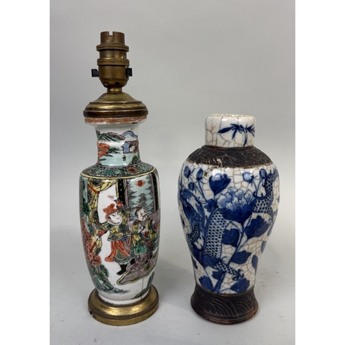 258 - A CHINESE KANGXI STYLE VASE ADAPTED FOR LAMP ALONG WITH A BLUE AND WHITE CRACKLE VASE
Tallest 21cm H... 